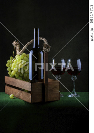 Still life with grapes and wine in glasses 69517715