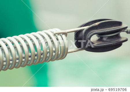 Steel spring on industrial or agricultural machinery, technology and engineering concept 69519706