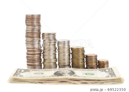 coins arranged as a graph and dollar banknotes isolated coins arranged as a graph and dollar banknotes isolated 69522350