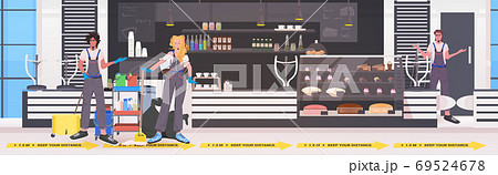 professional cleaners mix race janitors team cleaning and disinfecting floor to prevent coronavirus pandemic 69524678