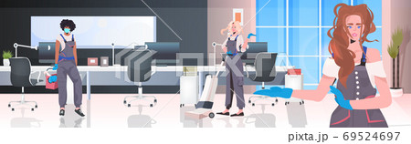 mix race cleaners team cleaning and disinfecting floor to prevent coronavirus pandemic 69524697