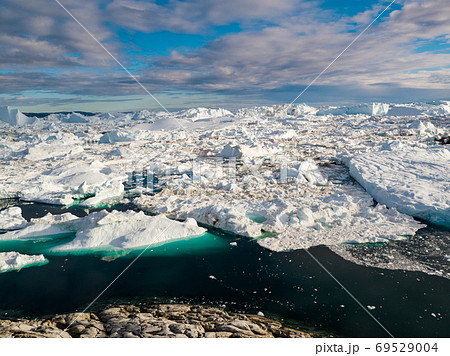 Iceberg and ice from glacier in arctic nature landscape on Greenland 69529004