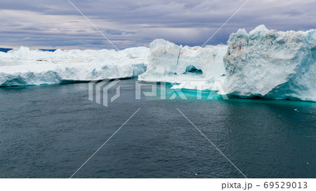 Iceberg and ice from glacier in arctic nature landscape in Ilulissat Greenland 69529013
