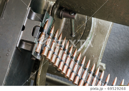 training cartridges from the machine gun in the tape are inserted training cartridges from the machine gun in the tape are inserted 69529268