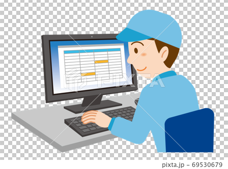 A man in blue work clothes wearing a hat working on a computer A man in blue work clothes wearing a hat working on a computer 69530679