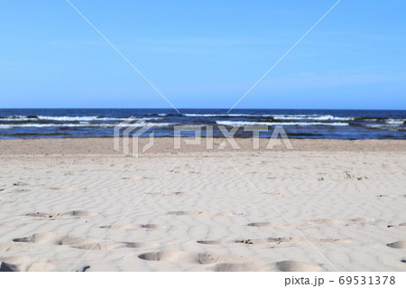Wavy sand with footsteps on baltic sea coast Wavy sand with footsteps on baltic sea coast 69531378