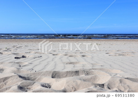 Wavy sand with footsteps on baltic sea coast 69531380