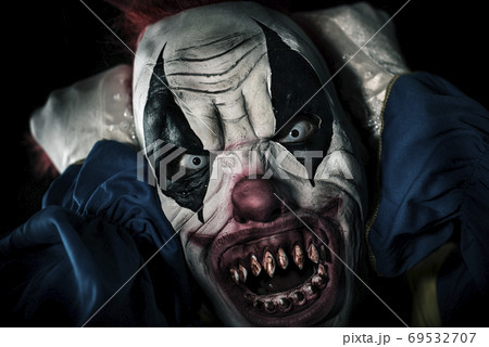 scary evil clown pulling his hair scary evil clown pulling his hair 69532707