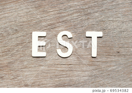 Alphabet letter in word est (abbreviation of established, estimated, eastern time zone, expressed sequence tag) on wood background Alphabet letter in word est (abbreviation of established, estimated, eastern time zone, expressed sequence tag) on wood background 69534382
