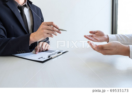 Businessman interview consider a resume 69535173