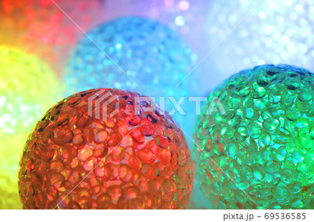 Christmas balls with light. Christmas evening background. Christmas balls with light. Christmas evening background. 69536585