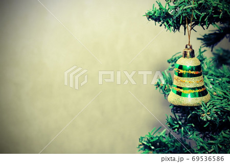 Christmas toy green bell on the Christmas tree. Copy Space. Christmas background.. Christmas toy green bell on the Christmas tree. Copy Space. Christmas background.. 69536586