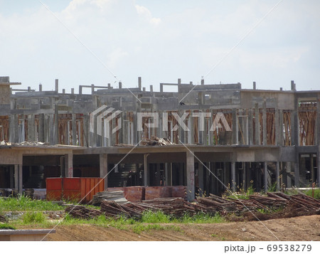 SEREMBAN, MALAYSIA -APRIL 08, 2020: New double story luxury terrace house under construction in Malaysia. Designed by an architect with a modern and contemporary style. SEREMBAN, MALAYSIA -APRIL 08, 2020: New double story luxury terrace house under construction in Malaysia. Designed by an architect with a modern and contemporary style. 69538279