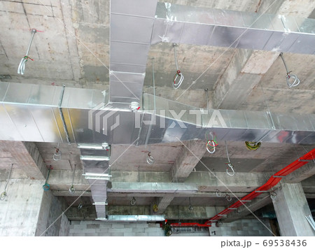 KUALA LUMPUR, MALAYSIA - AUGUST 31, 2019: Air-condition and ventilation duct under construction at the construction site. Distributing cool air and control the room's temperature.   69538436