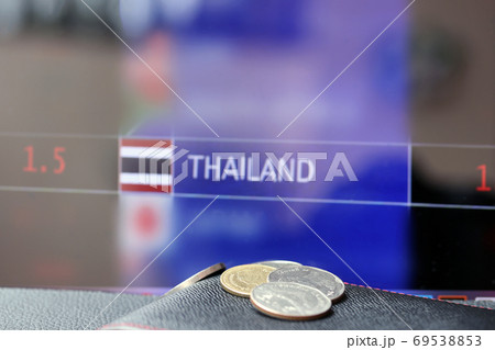 Pile of Thai baht coins on (THB) on black wallet with black floo 69538853