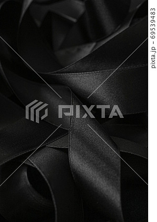 Black silk ribbon as background, abstract and luxury brand design Black silk ribbon as background, abstract and luxury brand design 69539483