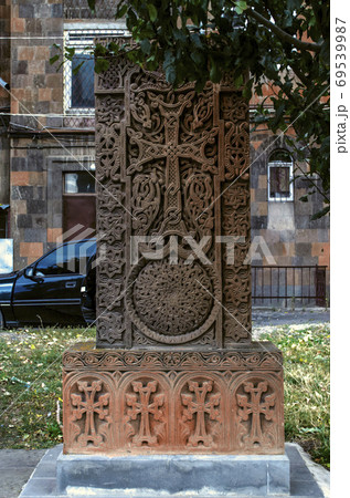 Khachkar stone with a large openwork cross in a wicker frame with a circle-a symbol of eternity in the Alley of crosses in Gyumri 69539987
