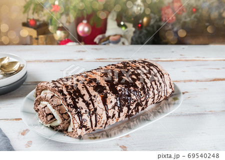 Belgian Chocolate Meringue Roulade filled with whipped cream and 69540248
