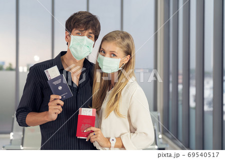 Life during covid-19 pandemic. young man and woman waiting for f Life during covid-19 pandemic. young man and woman waiting for f 69540517
