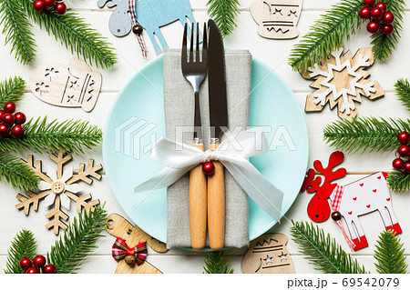 Top view of New Year dinner on festive wooden background. Compos 69542079