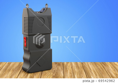 Stun Gun, electroshock weapon on the wooden table. 3D rendering 69542962