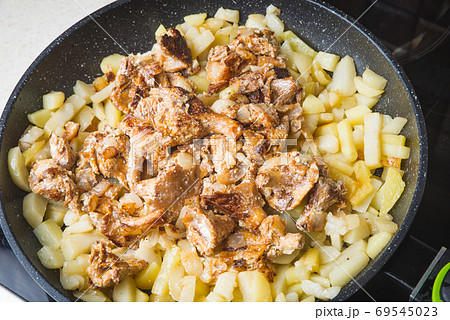 Mushrooms chanterelle fried with potatoes in a frying pan 69545023