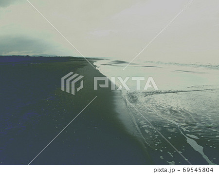 View of the sea from the beach on a cloudy day, with a vintage effect. View of the sea from the beach on a cloudy day, with a vintage effect. 69545804