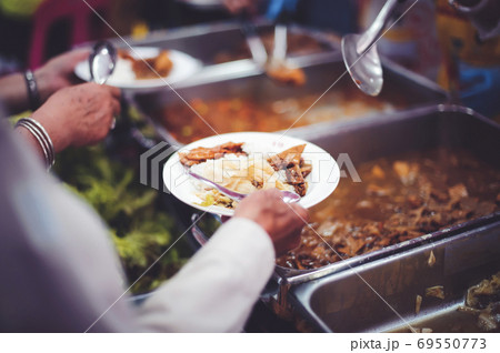 Food donation to relieve hunger. The concept of poverty Food donation to relieve hunger. The concept of poverty 69550773