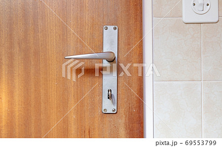 Key in wooden door Key in wooden door 69553799