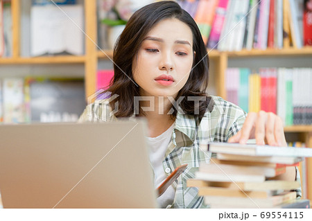 Woman in library Woman in library 69554115