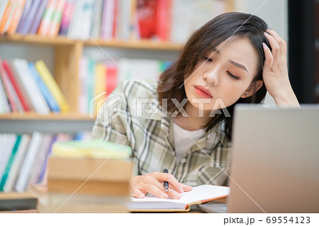 Woman in library Woman in library 69554123