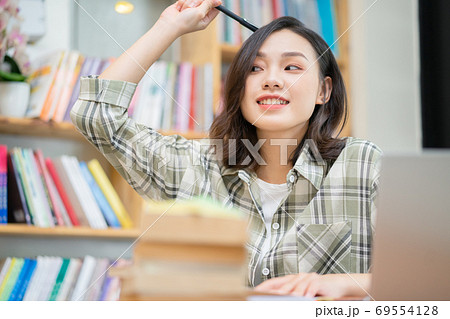 Woman in library Woman in library 69554128