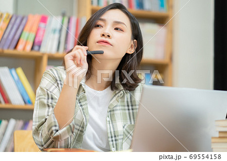 Woman in library Woman in library 69554158