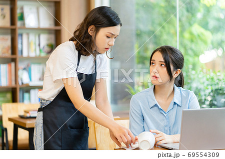 Woman in coffee shop Woman in coffee shop 69554309
