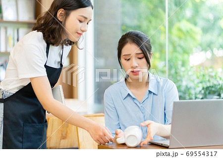Woman in coffee shop Woman in coffee shop 69554317