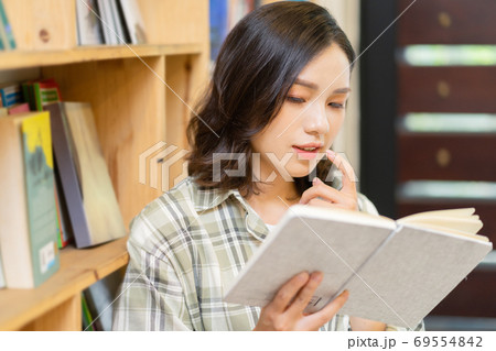 Woman in library Woman in library 69554842
