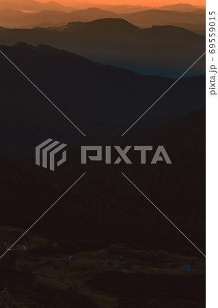 Fog or haze at sunrise in the Carpathians, Ukrainian Pip Ivan and sunrise near Montenegro, picturesque mountain landscapes. Fog or haze at sunrise in the Carpathians, Ukrainian Pip Ivan and sunrise near Montenegro, picturesque mountain landscapes. 69559015