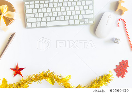 White Christmas, desk office with laptop, decoration and work supplies with cup of coffee. Top view with copy space for input the text. Flat lay desk table winter Christmas. Business Holidays Concept. 69560430