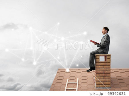 Man reading book and concept of social connection in sky 69562021