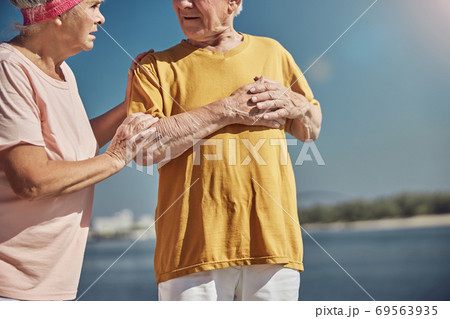 Man pressing his hand to the chest Man pressing his hand to the chest 69563935
