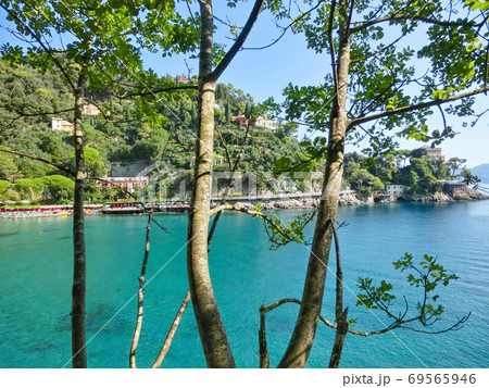 beach known as paraggi near portofino in genoa on a blue sky and sea background beach known as paraggi near portofino in genoa on a blue sky and sea background 69565946