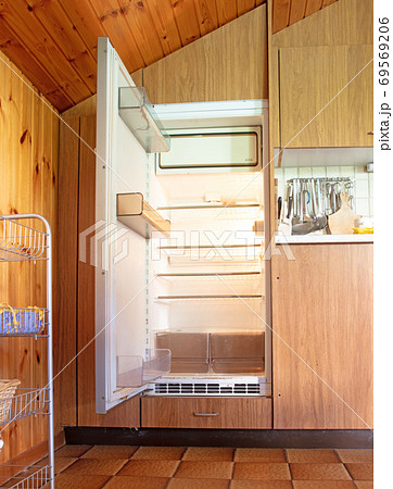 Old fridge in a dated kitchen Old fridge in a dated kitchen 69569206