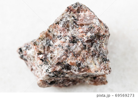 unpolished pink Granite rock on white marble unpolished pink Granite rock on white marble 69569273