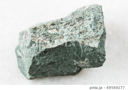 raw Tinguaite rock on white marble 69569277