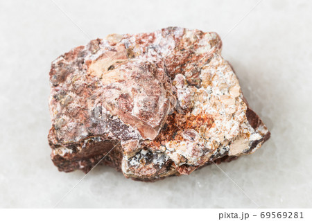 raw Rhyolite rock on white marble 69569281