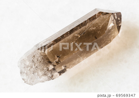 rough crystal of Smoky Quartz on white marble 69569347