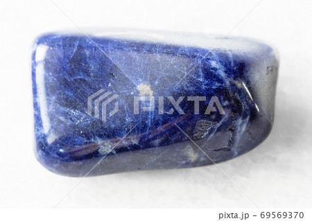 polished Sodalite rock on white marble 69569370