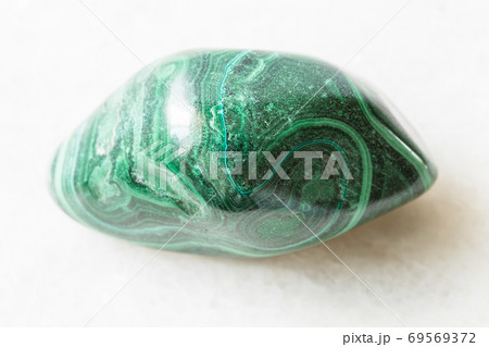 polished Malachite rock on white marble 69569372