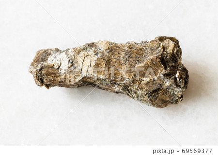 unpolished Bronzite (Enstatite) rock on white 69569377