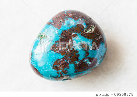 tumbled Chrysocolla with Cuprite rock on white 69569379